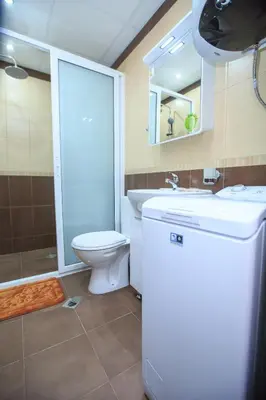 a bathroom with a toilet and a sink and a shower at Studio Ivana in Sandanski