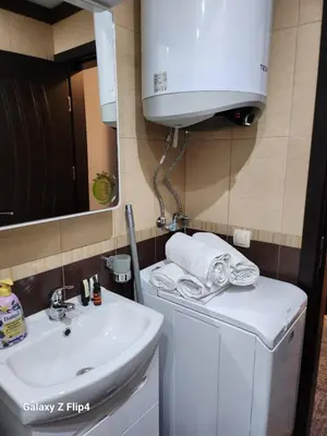 a small bathroom with a sink and a white sink at Studio Ivana in Sandanski