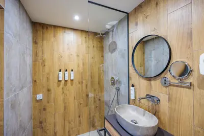a bathroom with a sink and a mirror at Iglika Hotel & Villas Borovets in Borovets