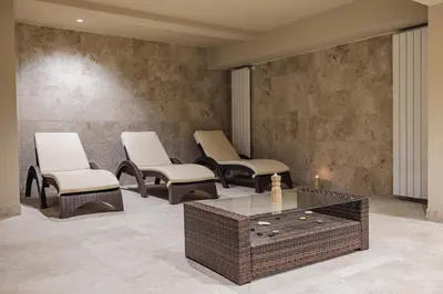 a lobby with chairs and a coffee table at Iglika Hotel & Villas Borovets in Borovets