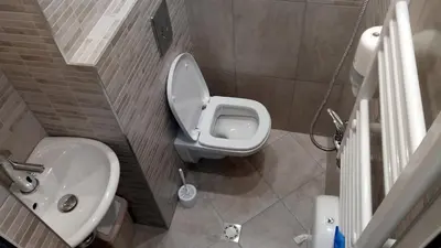 a small bathroom with a toilet and a sink at Khan Krum House & Apartments for rent in Elin Pelin