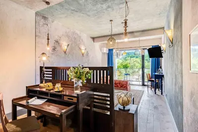 a living room with a table and a dining room at Boutique Hotel Casa Art in Oreshak