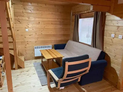 a small room with a bed and a table and a couch at Chalet Sofia in Borovets