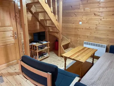 a small room with a wooden wall with a wooden table and a tableablish at Chalet Sofia in Borovets