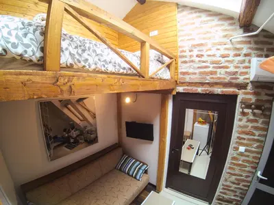 an overhead view of a room with a bunk bed at Vitosha Blvd - Attic Studio in Sofia