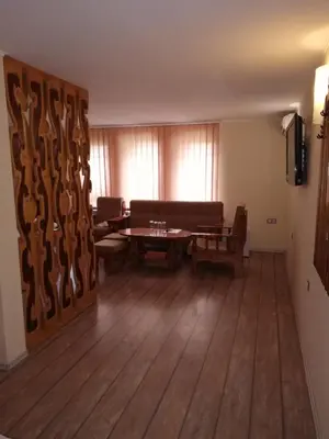 a living room with a couch and a table at Комплекс Рожена, хотел, хотелски комплекс Рожена in Rozhen