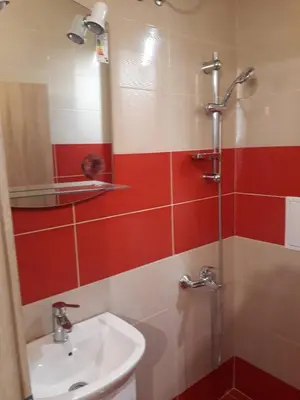 a bathroom with a sink and a shower at Cozy apartment in the heart of Sofia in Sofia