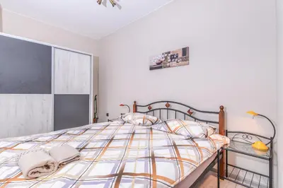 a bedroom with a bed and a glass table at Visit Sofia Macedonia Square Central Apartment by Flat Mаnager in Sofia