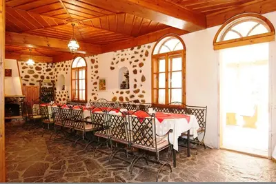 a room with a long table with chairs in it at Despot Slav Hotel & Restaurant in Melnik