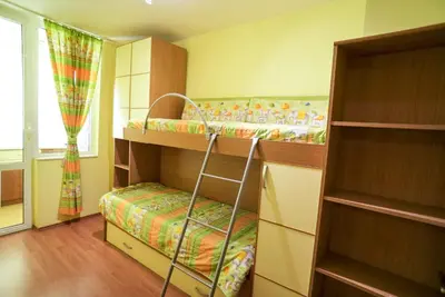 a bedroom with two bunk beds and a window at Apartment Geo Milev in Plovdiv