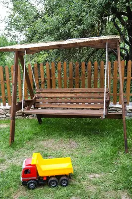 a toy truck sitting in front of a bench at Тодорината къща in Leshten