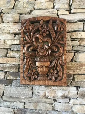 a wooden plaque on a brick wall at Pirin Golf Villa Emila in Bansko