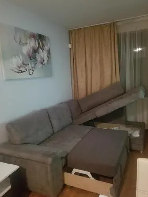 a living room with a couch and a table at Belveder Holiday Club Private in Bansko