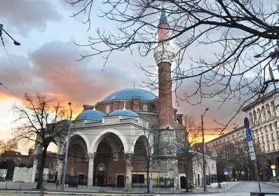 a large building with a tower on top of it at Ayki - historic centre apartment in Sofia