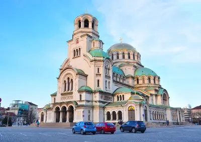 a church with cars parked in front of it at Ayki - historic centre apartment in Sofia