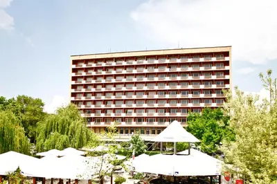 a hotel with a large building in the background at Rila Hotel Sofia in Sofia