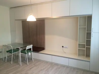 a dining room with a table and two chairs at Modern Studio 20 Meters from Mladost 1 Metro Station in Sofia