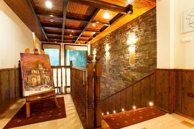 a room with a painting on a wooden wall at Hotel Villa Boyana - Free Parking in Sofia