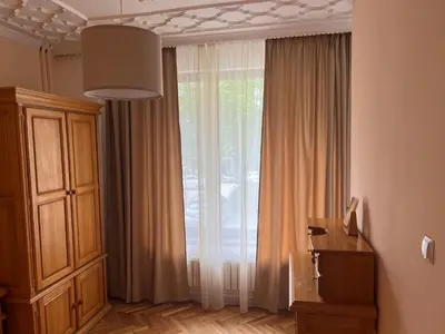 a room with a large window with curtains at Stivan Iskar Hotel in Sofia