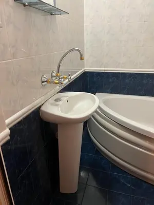 a bathroom with a sink and a toilet at Stivan Iskar Hotel in Sofia