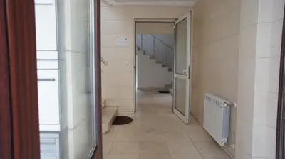 a hallway with a staircase in a building at City Apartments in Sofia