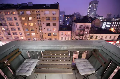 a view from the top of a building with two chairs at City Apartments in Sofia