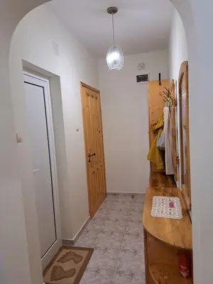 a hallway with a wooden counter and a door at Apartment Beti in Devin