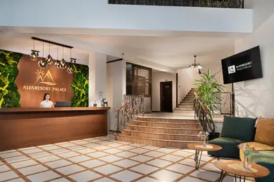 a lobby of an antwerp palace hotel with a staircase at Alfaresort Palace Chiflika in Chiflik