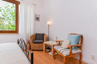 a bedroom with a bed and a chair and a table at Shik & Chic One Bedroom Central Apartment Graf Ignatiev x Shishman Corner by Flat Mаnager in Sofia