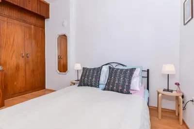 a bedroom with a bed with two pillows on it at Shik & Chic One Bedroom Central Apartment Graf Ignatiev x Shishman Corner by Flat Mаnager in Sofia