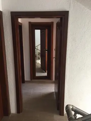 a hallway with a mirror in a room at Guest Rooms Vachin in Bansko