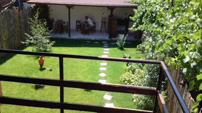 a view of a yard with a fence at Avel Guest House in Sofia