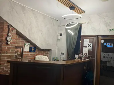 a bar in a room with a brick wall at Family Hotel Lazur in Bansko