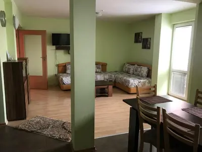 a room with a dining table and a living room at BLOCK 531 ApartHouse BLOCK 533 in Sofia