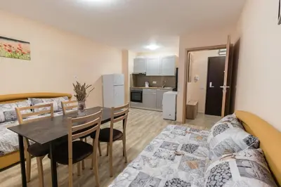 a living room with a table and a couch at BLOCK 531 ApartHouse BLOCK 533 in Sofia