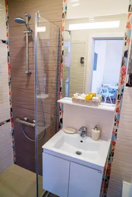 a bathroom with a sink and a shower at Sofia Central Pretty Apartment in Sofia