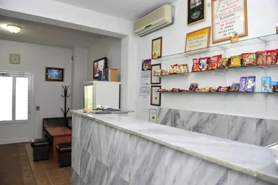 a bar in a restaurant with a counter at Family Hotel Blazhi in Sandanski