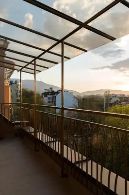 a balcony with a view of the mountains at Center apartment with amazing view in Sofia
