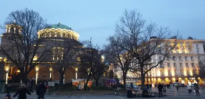 a lit up building with a dome on top of it at Center apartment with amazing view in Sofia
