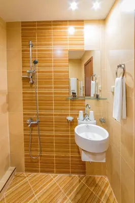 a bathroom with a sink and a shower at Eleganza Family Hotel - Free Parking in Sofia
