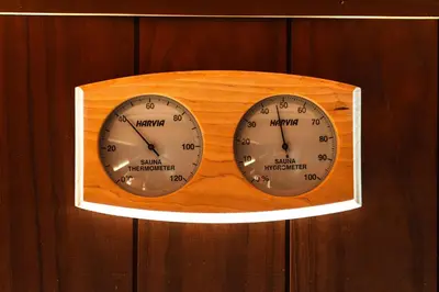 a clock is hanging on a wooden wall at Family Hotel Edia-Sandanski in Sandanski