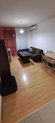a living room with a couch and a table at spa in Plovdiv