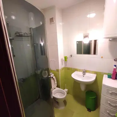 a bathroom with a shower and a toilet and a sink at spa in Plovdiv