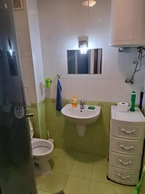 a bathroom with a toilet and a sink at spa in Plovdiv
