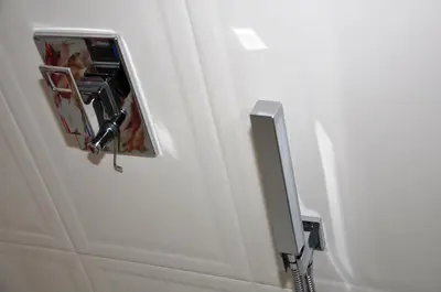 a close up of a door with a mirror at Lux Apartment in Pazardzhik