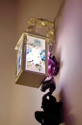 a picture hanging on a wall with a light at Hello Sofia Guesthouse in Sofia