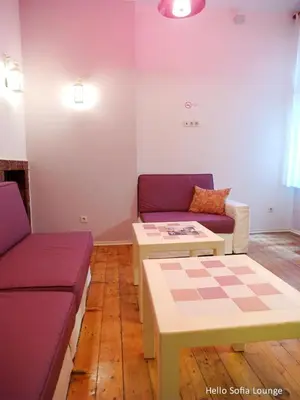 a living room with a couch and a table at Hello Sofia Guesthouse in Sofia
