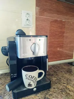 a coffee maker with a cup on top of it at Holiday Home Veli in Sapareva Banya