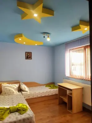 a bedroom with two beds with stars on the ceiling at Holiday Home Veli in Sapareva Banya