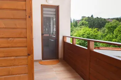 a door to a balcony with a view at Апартамент 